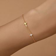 Foto de Pulsera de plata baño de oro con cruz y flor de circonitas